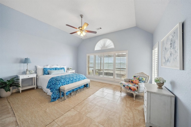 bedroom featuring visible vents, a ceiling fan, light tile patterned floors, and vaulted ceiling