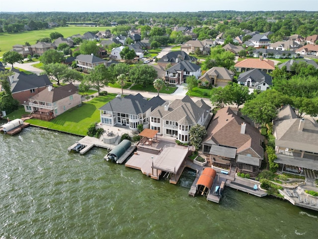 bird's eye view featuring a water view and a residential view