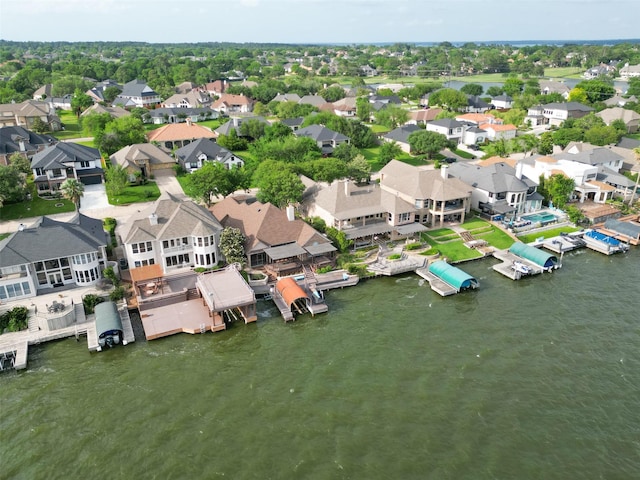 bird's eye view with a residential view and a water view
