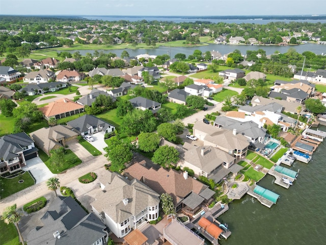 drone / aerial view with a residential view and a water view