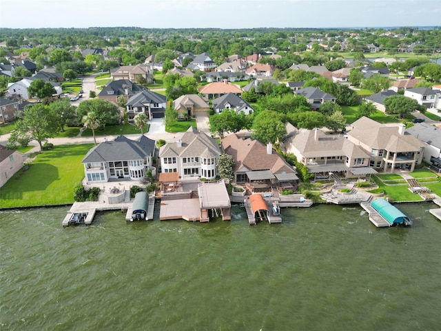 birds eye view of property with a water view and a residential view