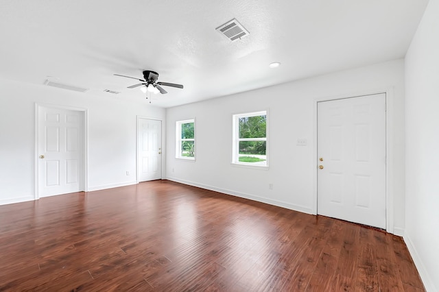 2114 Lone Star St, La Marque, TX 77568 - empty room with a ceiling fan, visible vents, and dark wood-type flooring