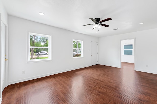 2114 Lone Star St, La Marque, TX 77568 - spare room with baseboards, dark wood-style flooring, ceiling fan, and visible vents