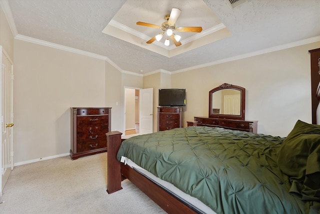 bedroom with crown molding, baseboards, ceiling fan, a raised ceiling, and carpet flooring