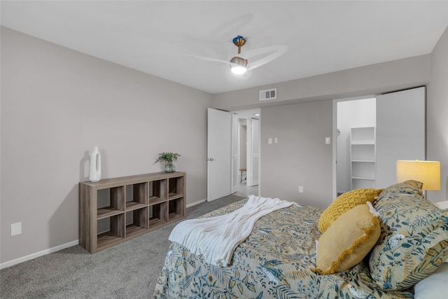 carpeted bedroom featuring a ceiling fan, baseboards, and visible vents