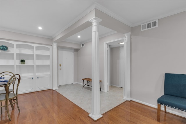 living area with crown molding, visible vents, ornate columns, recessed lighting, and light wood-type flooring