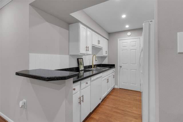 kitchen featuring a sink, white cabinetry, white appliances, and light wood-style flooring