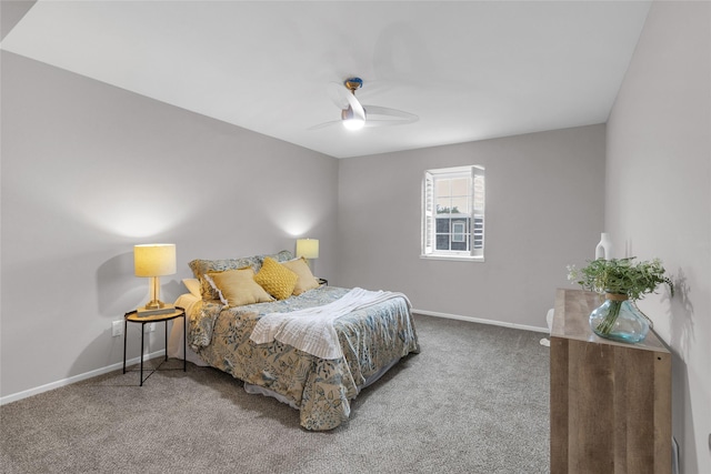carpeted bedroom with baseboards and a ceiling fan