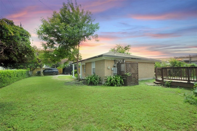 1246 W 21st St, Houston, TX 77008 - yard at dusk with a yard and a deck