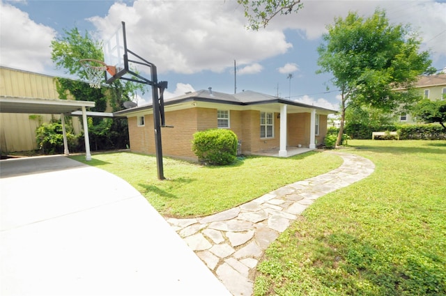 1246 W 21st St, Houston, TX 77008 - view of side of home featuring a yard, brick siding, and driveway
