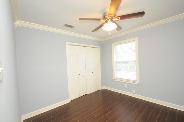 1246 W 21st St, Houston, TX 77008 - unfurnished bedroom with crown molding, baseboards, dark wood-style floors, a closet, and ceiling fan