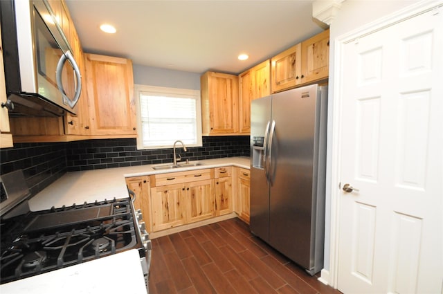 1246 W 21st St, Houston, TX 77008 - kitchen featuring appliances with stainless steel finishes, light brown cabinets, a sink, light countertops, and backsplash