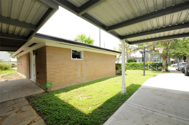 1246 W 21st St, Houston, TX 77008 - view of home's exterior featuring brick siding, a yard, and a patio area