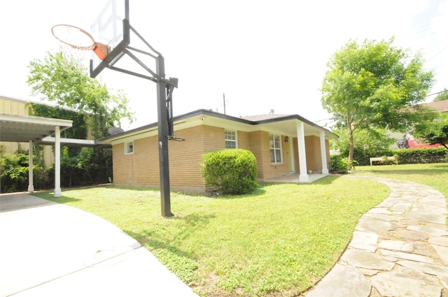 1246 W 21st St, Houston, TX 77008 - view of property exterior featuring brick siding, a yard, and concrete driveway
