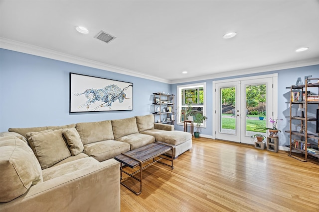 living room with visible vents, crown molding, light wood-style floors, baseboards, and recessed lighting