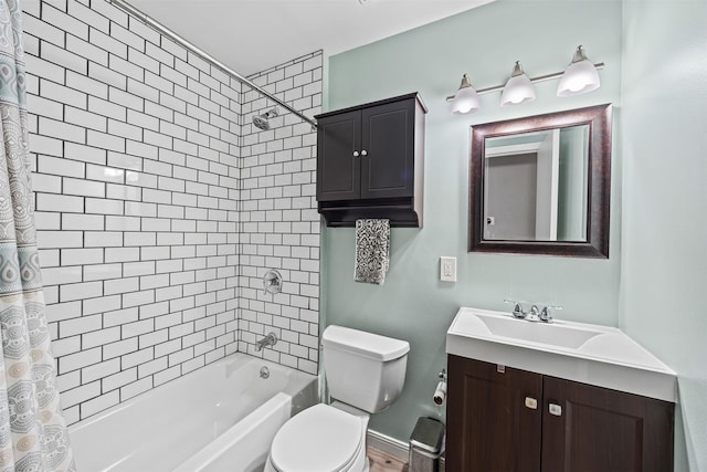 bathroom with vanity, shower / bathtub combination with curtain, and toilet