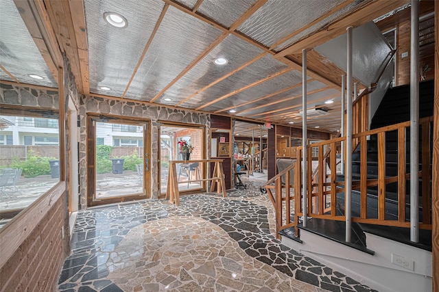 interior space with stone floors and recessed lighting