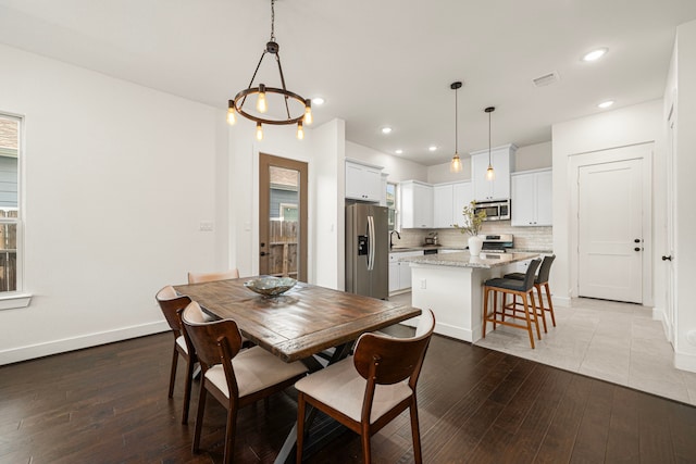 dining space featuring visible vents, recessed lighting, and light wood-style flooring