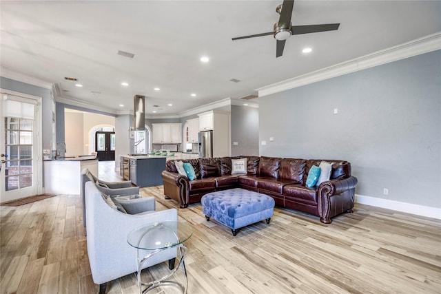 16122 Wimbledon Forest Dr, Spring, TX 77379 - living room with ornamental molding, light wood finished floors, a ceiling fan, recessed lighting, and baseboards