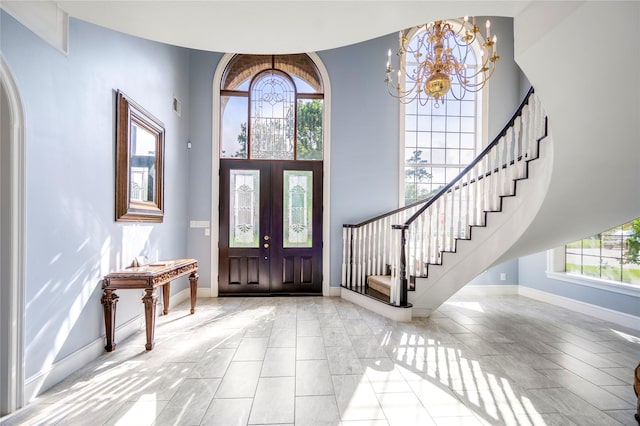 16122 Wimbledon Forest Dr, Spring, TX 77379 - foyer featuring stairs, a chandelier, baseboards, french doors, and a towering ceiling