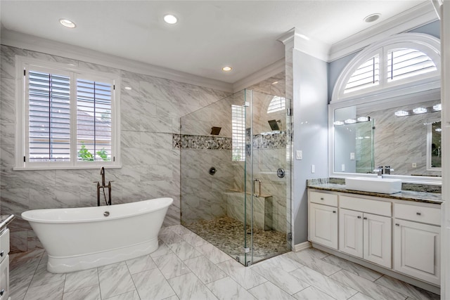 16122 Wimbledon Forest Dr, Spring, TX 77379 - bathroom featuring marble finish flooring, a stall shower, vanity, a freestanding tub, and recessed lighting