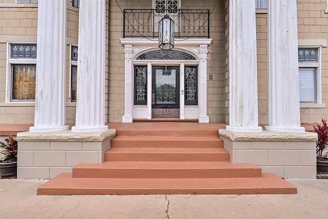 view of exterior entry with a porch