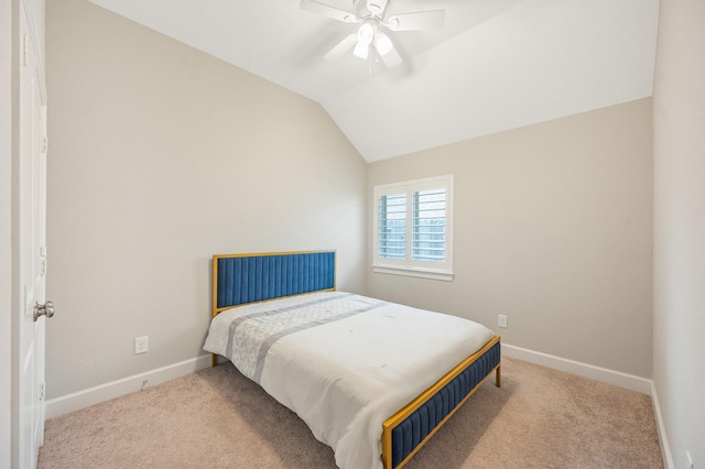 carpeted bedroom with baseboards, ceiling fan, and lofted ceiling