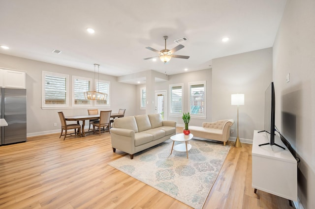 living area with visible vents, recessed lighting, baseboards, and light wood-style floors