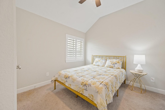 bedroom with carpet flooring, a ceiling fan, baseboards, and vaulted ceiling