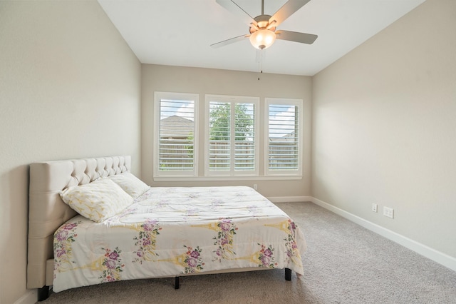 carpeted bedroom with baseboards and ceiling fan