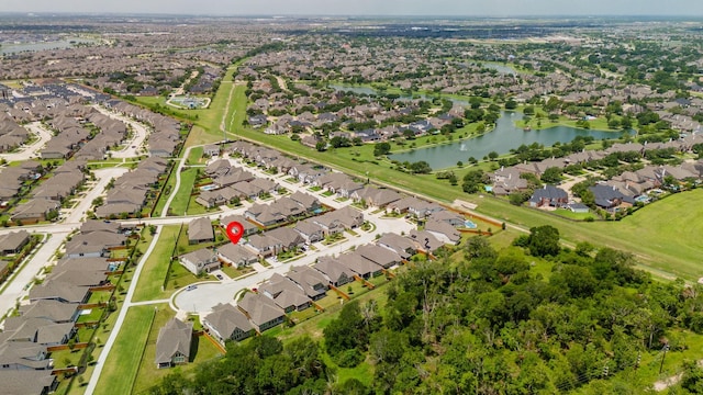bird's eye view with a residential view and a water view