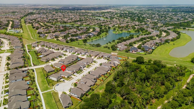 bird's eye view with a residential view and a water view
