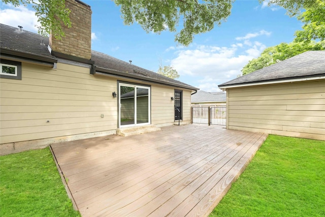 wooden terrace featuring a yard
