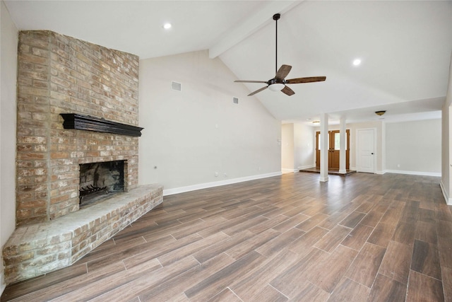 unfurnished living room featuring baseboards, a fireplace, a ceiling fan, and wood finished floors