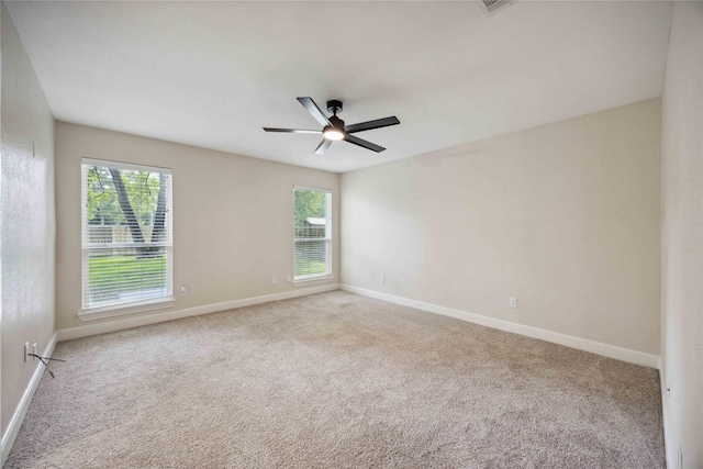 unfurnished room with baseboards and carpet flooring