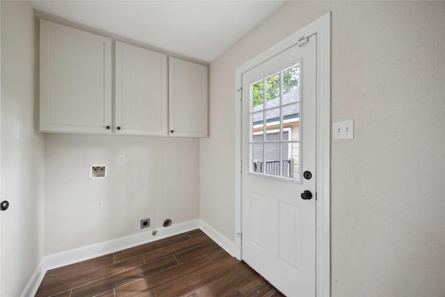 laundry area featuring hookup for an electric dryer, cabinet space, baseboards, dark wood-style floors, and hookup for a washing machine