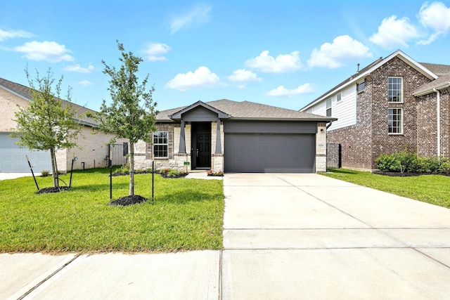 15219 Faushard Ln, Houston, TX 77044 - view of front of property featuring an attached garage, a front lawn, concrete driveway, and brick siding