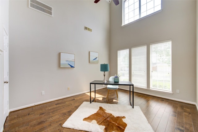 7206 Fountain Mdw, Katy, TX 77494 - office space featuring ceiling fan, visible vents, baseboards, a high ceiling, and hardwood / wood-style floors