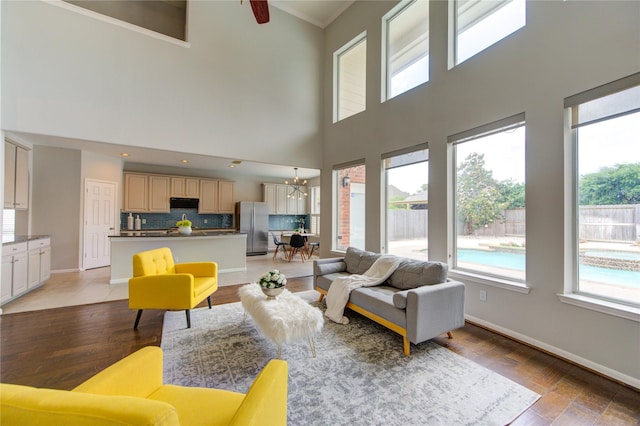 7206 Fountain Mdw, Katy, TX 77494 - living room with a high ceiling, a notable chandelier, and a healthy amount of sunlight