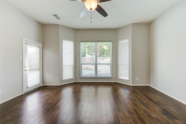 7206 Fountain Mdw, Katy, TX 77494 - empty room featuring visible vents, a ceiling fan, dark wood-style flooring, and baseboards