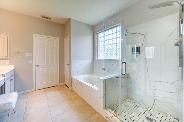 7206 Fountain Mdw, Katy, TX 77494 - bathroom featuring visible vents, tile patterned flooring, vanity, a bath, and a marble finish shower