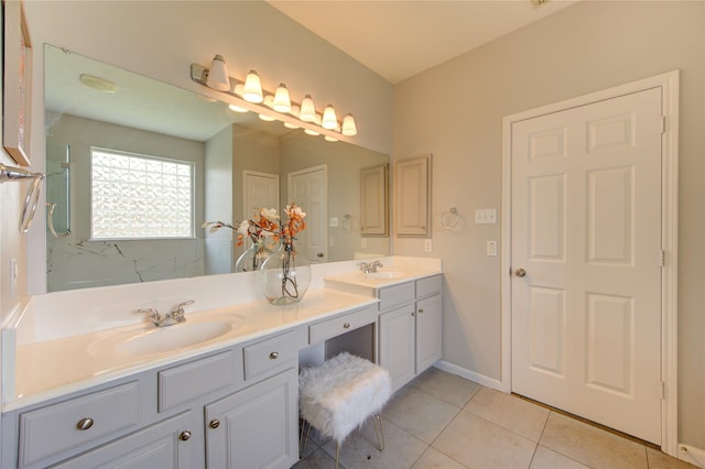 7206 Fountain Mdw, Katy, TX 77494 - bathroom featuring a sink, tile patterned floors, baseboards, and double vanity