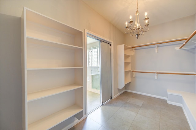 7206 Fountain Mdw, Katy, TX 77494 - walk in closet featuring an inviting chandelier and tile patterned floors