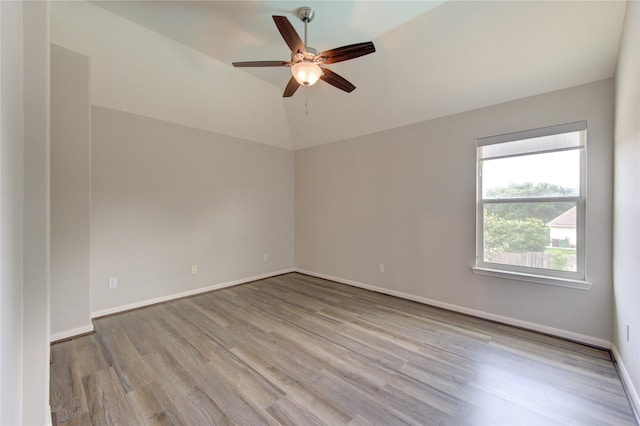 7206 Fountain Mdw, Katy, TX 77494 - unfurnished room featuring baseboards, a ceiling fan, wood finished floors, and vaulted ceiling
