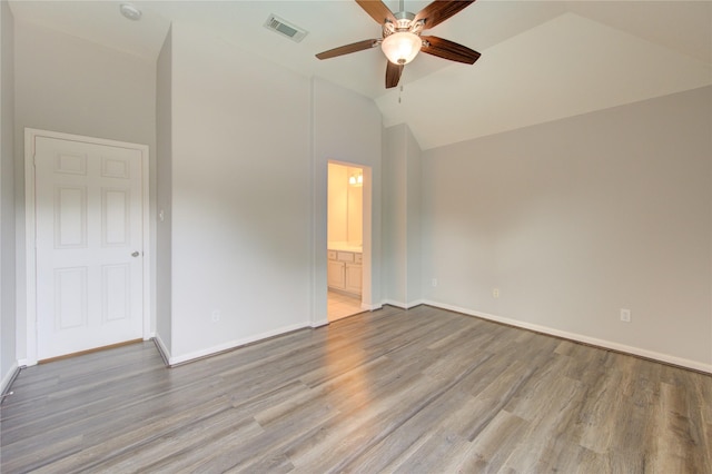 7206 Fountain Mdw, Katy, TX 77494 - unfurnished bedroom featuring visible vents, baseboards, lofted ceiling, and wood finished floors