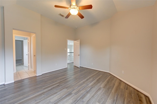 7206 Fountain Mdw, Katy, TX 77494 - empty room featuring a ceiling fan, visible vents, wood finished floors, and lofted ceiling