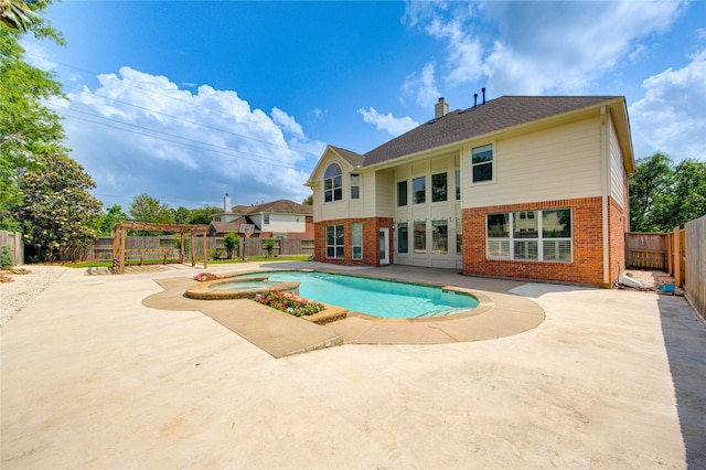 7206 Fountain Mdw, Katy, TX 77494 - view of pool featuring a patio, a pool with connected hot tub, and a fenced backyard