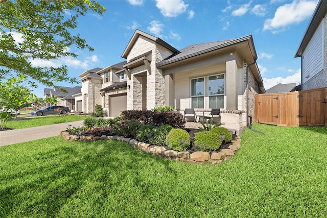 3040 Cirrus Heights Ct, Katy, TX 77493 - view of front facade with stone siding, concrete driveway, a gate, and a garage
