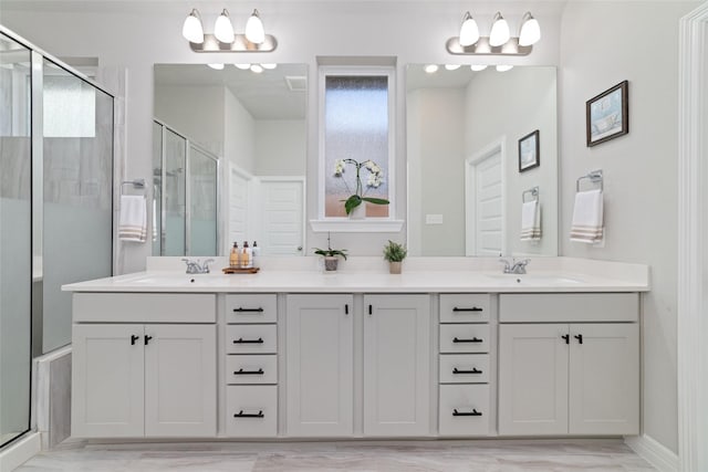 3040 Cirrus Heights Ct, Katy, TX 77493 - bathroom with double vanity, a stall shower, and baseboards