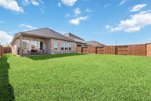 3040 Cirrus Heights Ct, Katy, TX 77493 - rear view of house with brick siding, a patio area, and roof with shingles